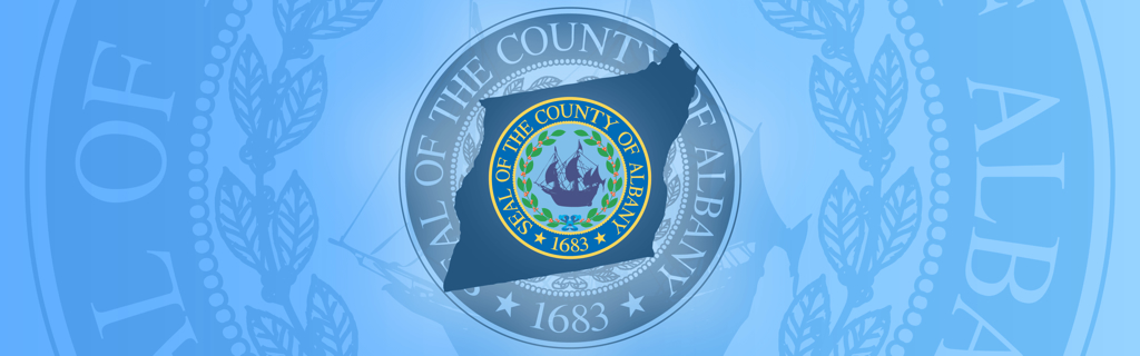 Decorative graphic image layering the County seal in various monochromatic and full-color versions, with the shape of the County map